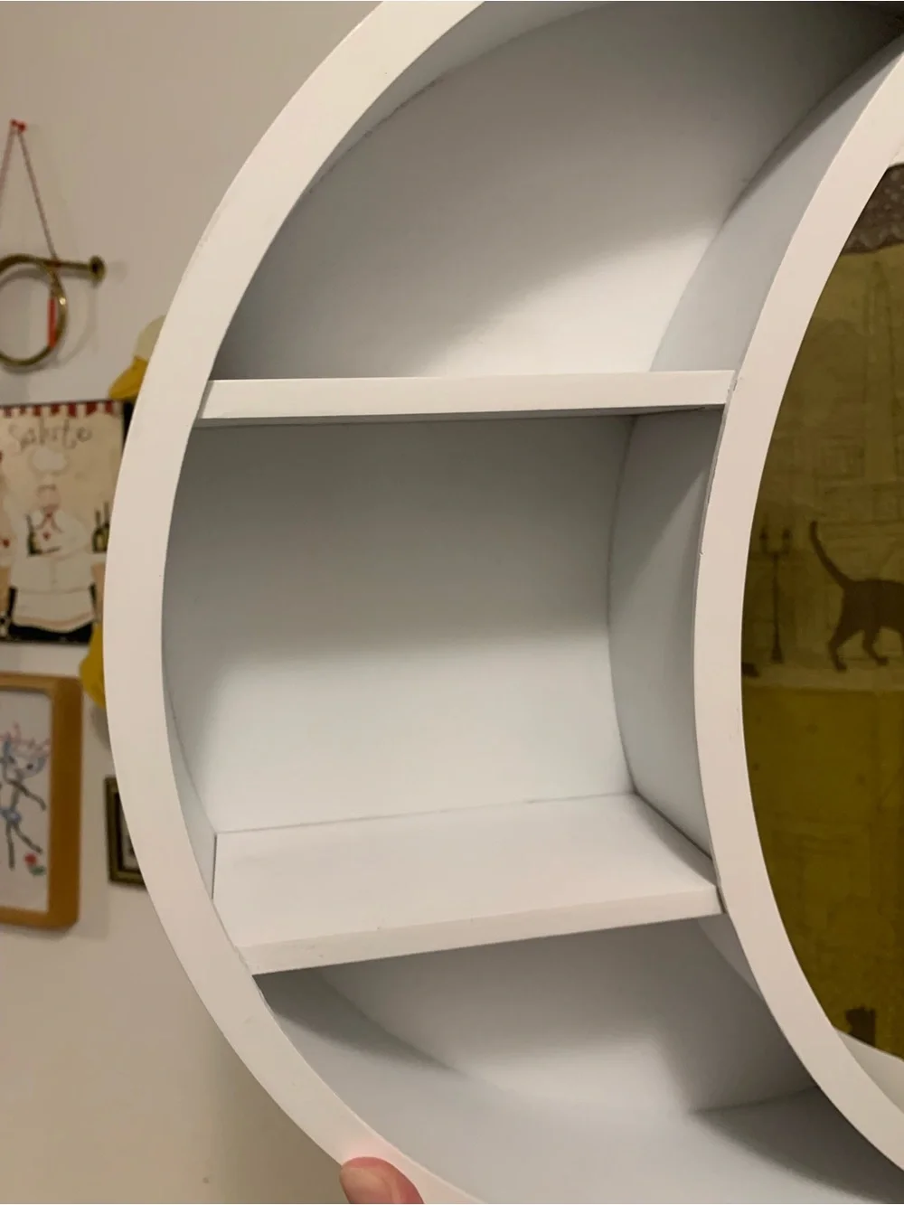 White crescent moon wall shelf faces either way